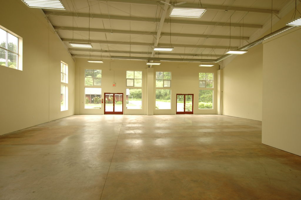 Interior at 357 Main Street. Looking from the back of the space towards the front doors at Main Street.